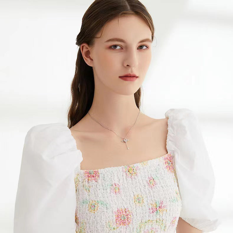 Collier en forme de cœur et d'ailes d'ange en mouvement avec chaîne